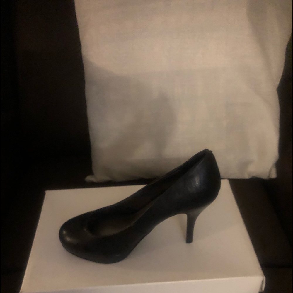 Black leather pumps